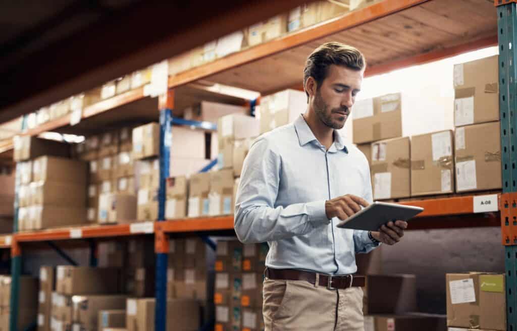 Human checking inventory throughout warehouse