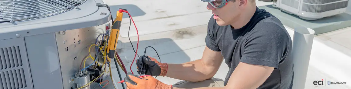 a technician working on HVAC equipment on a roof