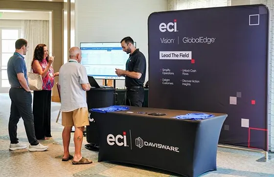 dw-events-hero-photo photo of an ECI representative at a trade show booth speaking with attendees