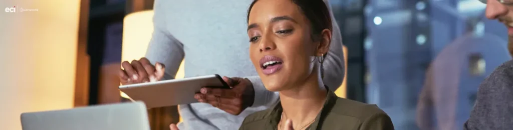 photo of a business woman looking at a laptop screen