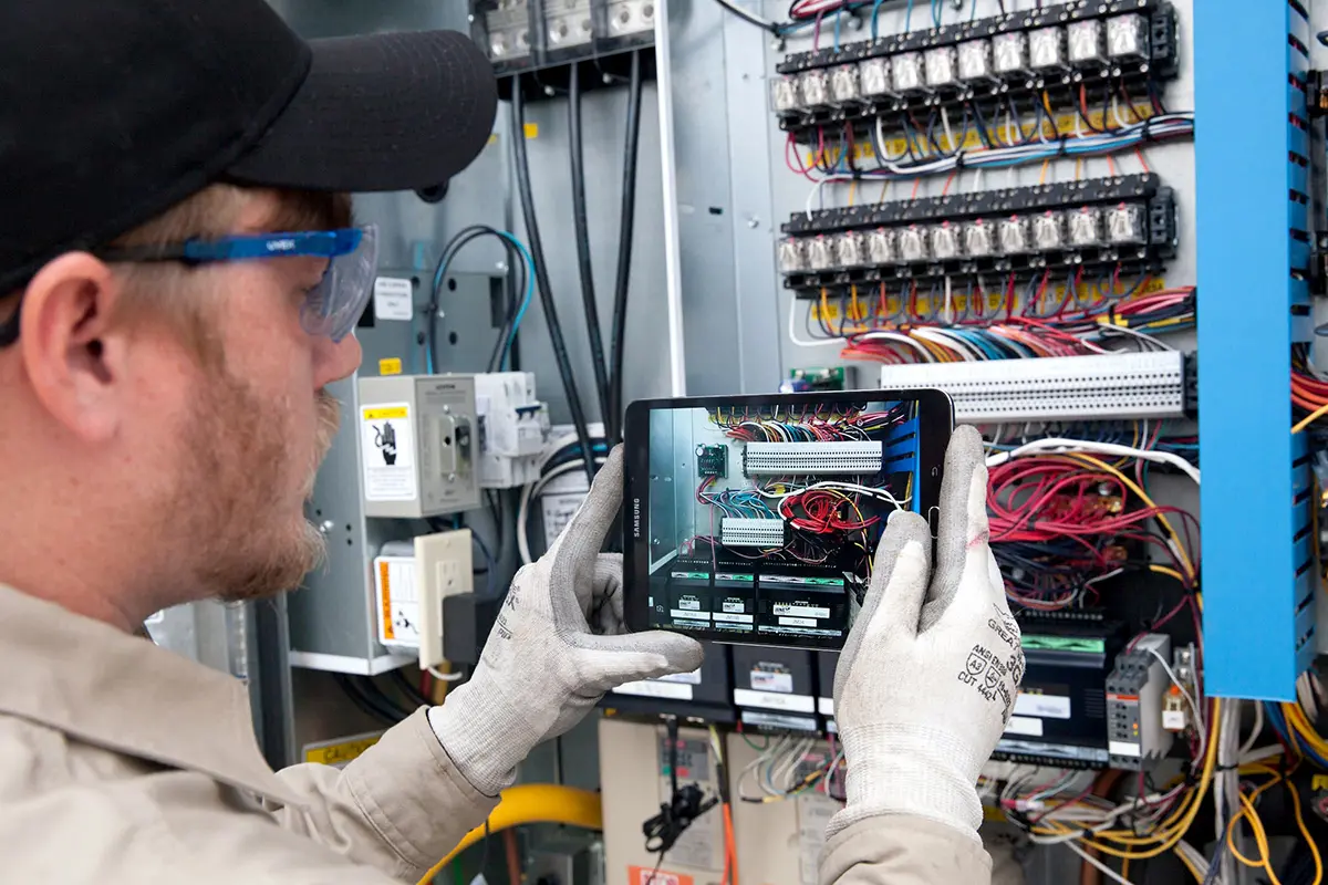 photo of a technician working at an electrical panel